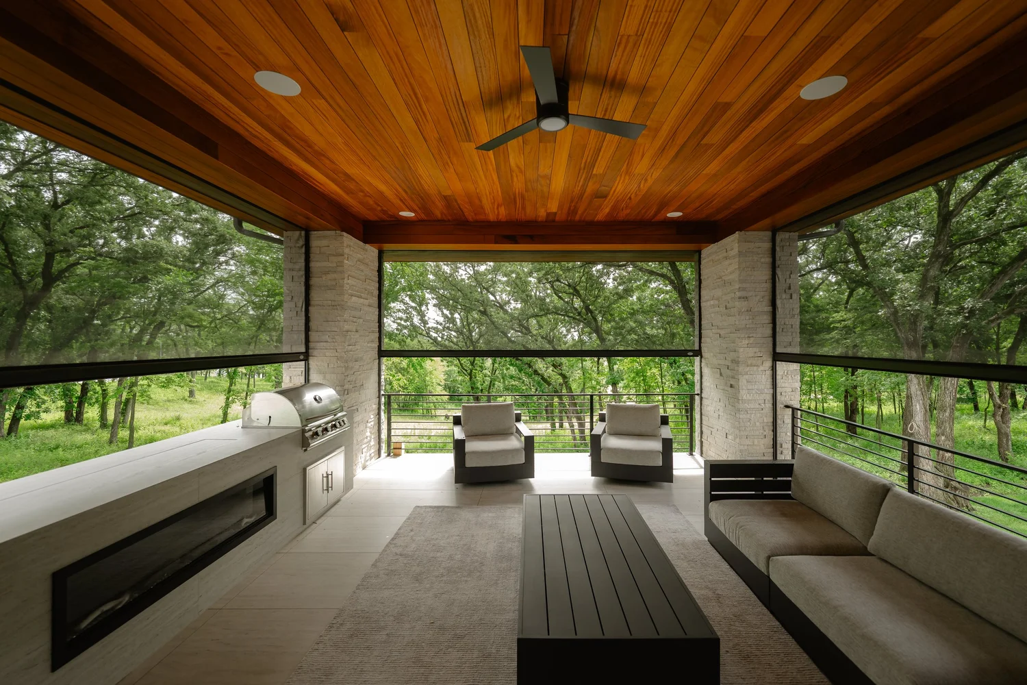 A beautiful patio surrounded by automatic roller shades.